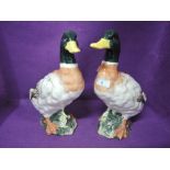 A pair of vintage ceramic duck figures