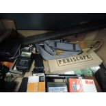 A box of various photographic items including light meters, filters, periscope, etc