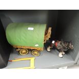 A vintage model of a gypsy or travellers caravan or cart