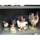 A selection of vintage ceramic hen chicken and Rooster figures