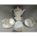 A vintage art deco tea service by Shelley with hand decorated floral design rdno. 823343