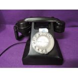A vintage bakelite telephone by AEP