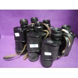 Three pairs of binoculars all in leather cases, a Zeiss Jena 7x50, a Wray Eleive 11x60 and a Russian