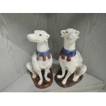 A pair of vintage ceramic Greyhound dog figures