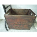 A vintage advertising bottle crate for Alexander and son's Kendal