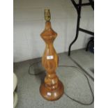 A vintage treen wood lamp with turned body