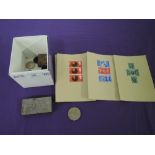 A selection of vintage collectable coins and stamps