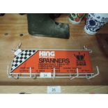 A vintage advertising hook rack for King International Garage and motor spanners