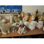 A selection of vintage ceramic cat figures including Tabby cat, Ginger, Siamese etc