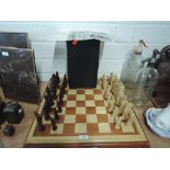 A vintage chess set by Studio Anne Carlton, Alice through the looking glass with treen wood board.