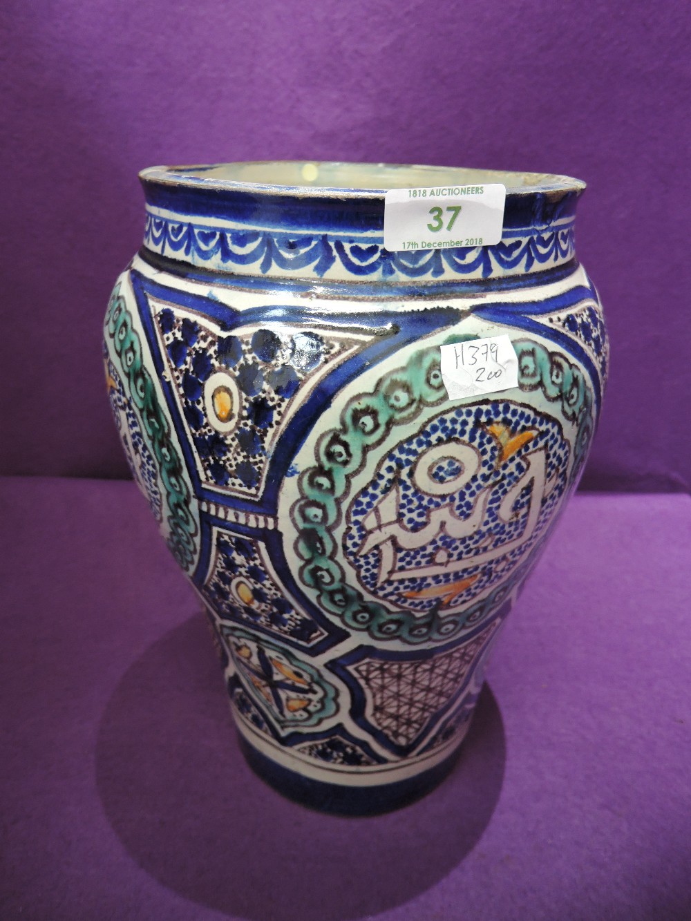 A Persian design pottery vase having Iznik style decoration