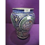 A Persian design pottery vase having Iznik style decoration