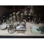 A selection of silver plate including candelabra, goblets, trays, teapot, sauce boat etc