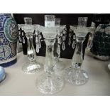 A selection of pressed glass candle sticks with lustre droplets