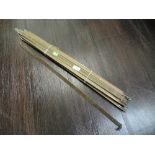 A selection of Art Deco style brass carpet or stair rods