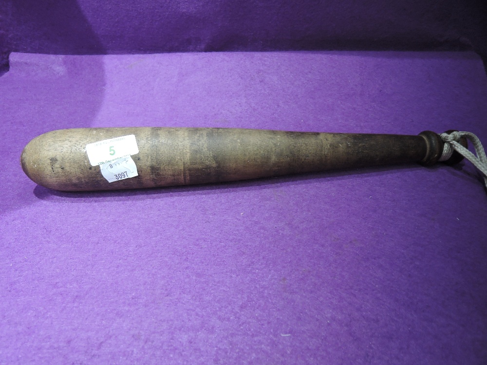 A vintage treen wood police style batton or truncheon