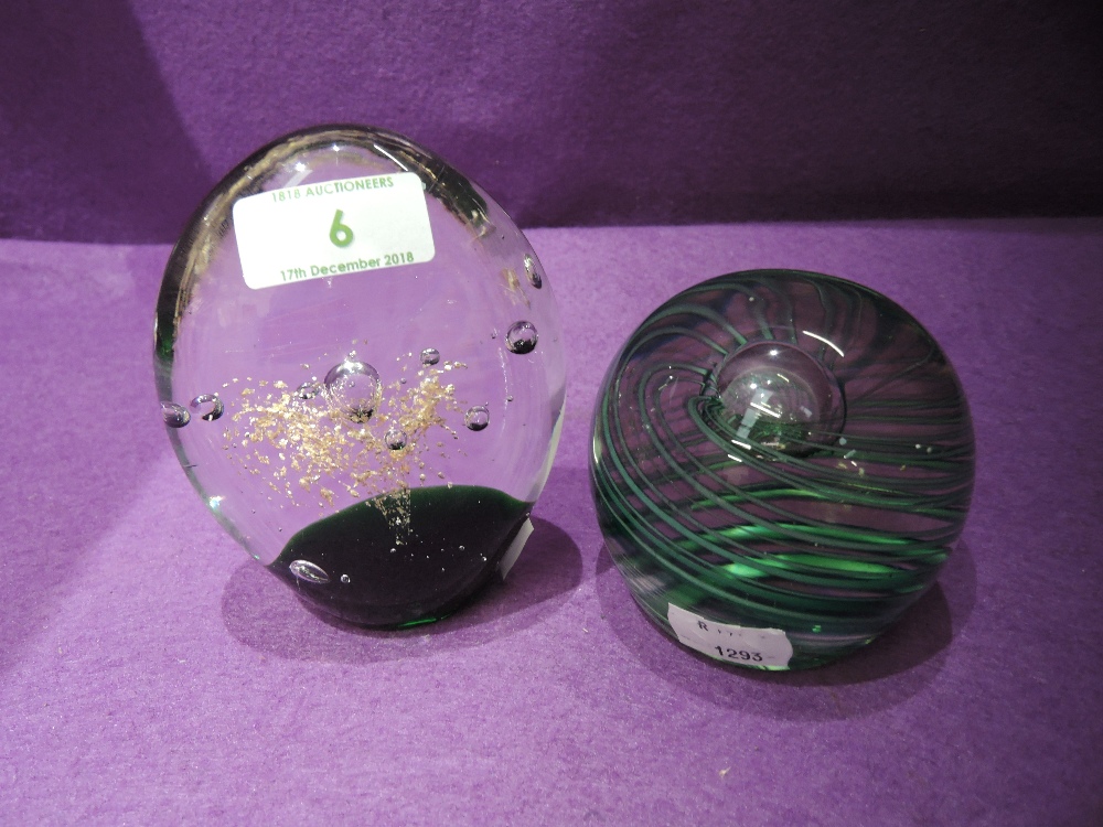 Two glass paper weights with decorative splash and swirl designs