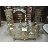 A selection of ornate cast brass of pierced foliate design including candlesticks, inkstand etc