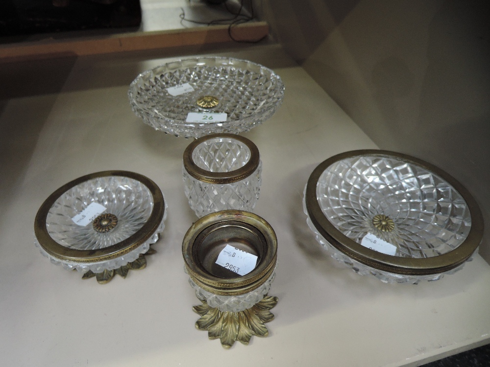 A 19th century cut glass and ormolu design tazza modelled as caryatid support (one missing) and