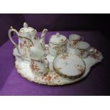 A vintage ceramic tea for one service by Limoges France