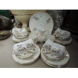 A vintage part tea service un marked white glaze with gold decal