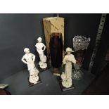 Three Florence figurines, a art glass vase and a decorative glass vase
