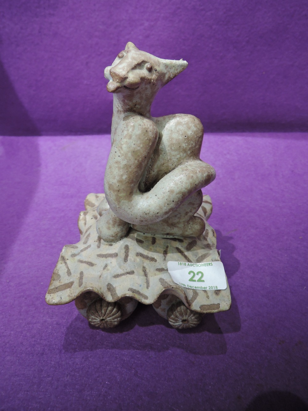 A Studio Pottery ornament modelled as cat on trolley
