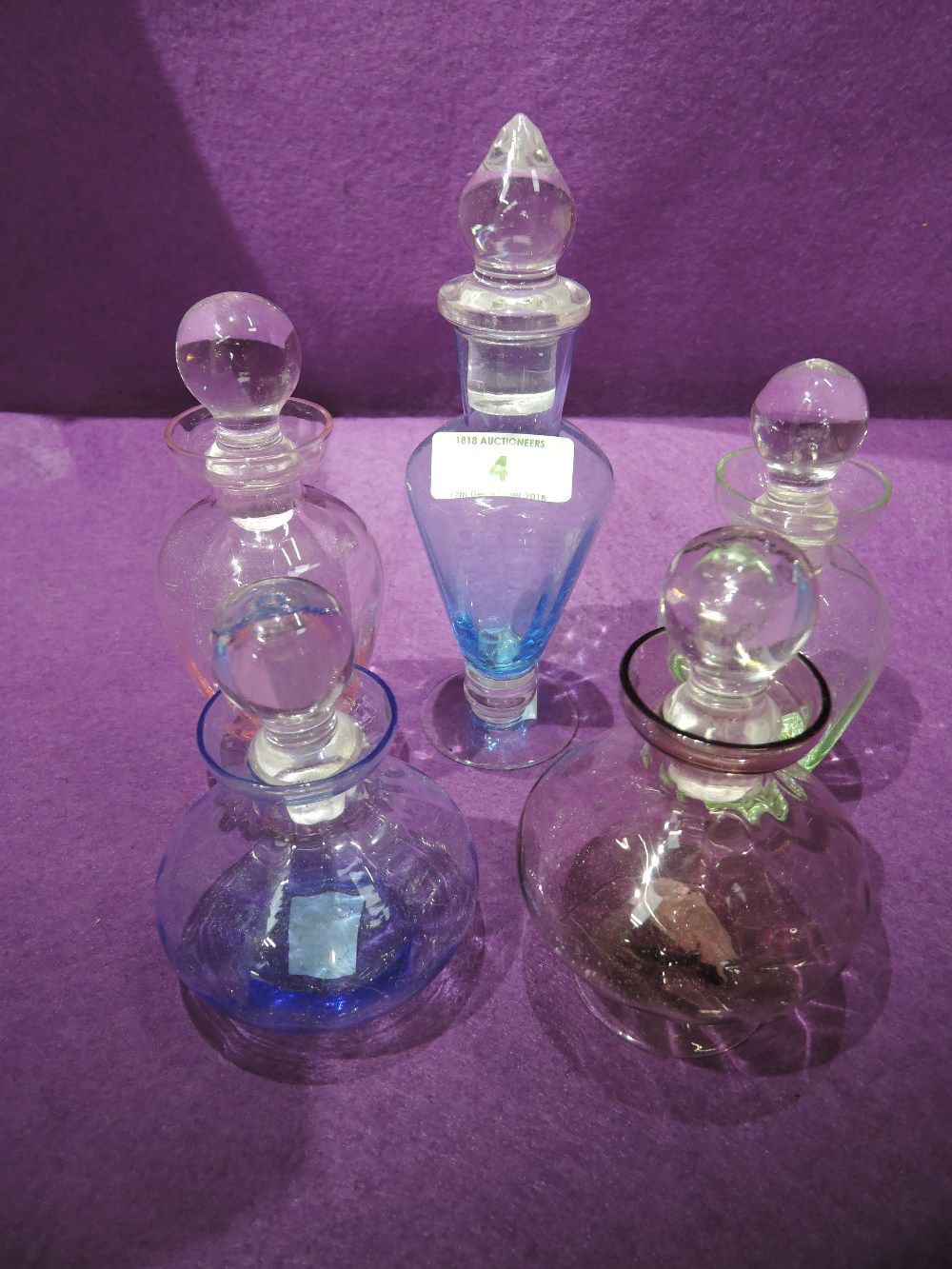 A selection of colour scent or perfume bottles some hand blown