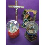 A selection of religious themed snow globes and nativity diorama