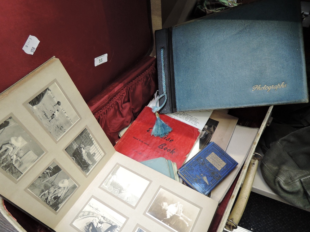 A collection of ephemera in suitcase including diaries, photograph albums 1900-1950s