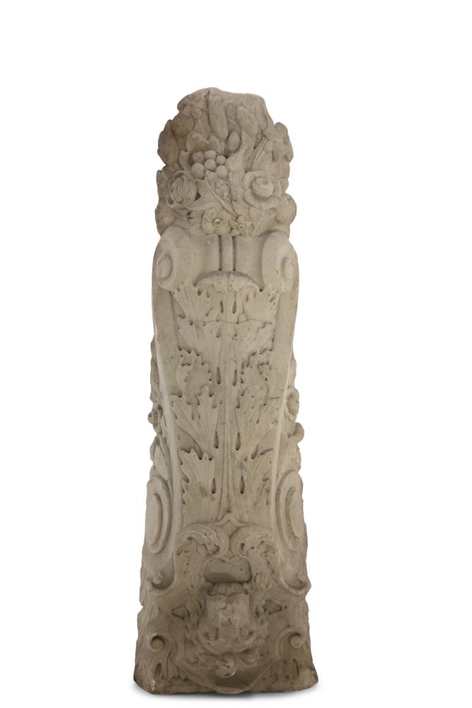 A CARVED WHITE MARBLE ARCHITECTURAL CORBEL, of rectangular tapering form, with lion mask within a