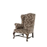 A GEORGIAN STYLE MAHOGANY FRAMED WINGBACK ARMCHAIR, with arched padded back and seat, out-