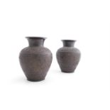 A PAIR OF NEO-GRECIAN BRONZE VASES, of shaped baluster form , the exterior decorated with bands of