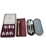 A CASED SET OF SIX SILVER GRAPEFRUIT SPOONS, London 1922, with cast taper handles; together with a