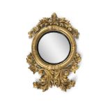 A LARGE REGENCY CIRCULAR CONVEX MIRROR, the mirror plate surrounded by a reeded ebon slip and