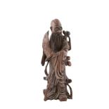 A CHINESE CARVED HARDWOOD FIGURE OF AN IMMORTAL, 19th Century. 44cm tallProvenance: Rathescar House,