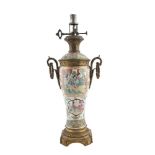 A CHINESE 19TH CENTURY CANTON OIL LAMP, fitted with ormolu ring side handles and mounts, the body