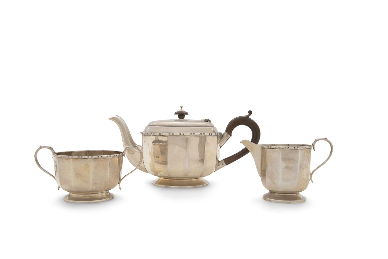 A THREE PIECE SILVER TEA SERVICE, Sheffield 1930, mark of George Wish Ltd, comprising teapot,