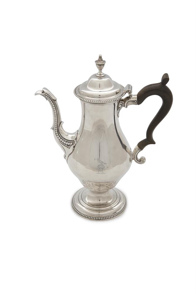 A GEORGE III SILVER COFFEE POT, London 1774, mark of Charles Wright, of circular baluster form,