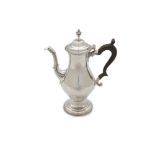 A GEORGE III SILVER COFFEE POT, London 1774, mark of Charles Wright, of circular baluster form,