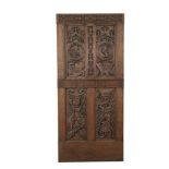 A CONTINENTAL 18TH CENTURY CARVED OAK DOOR PANEL, similarly decorated to the previous lot, lacking