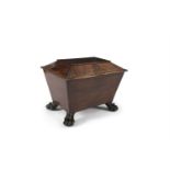 A GEORGE IV MAHOGANY SARCOPHAGUS SHAPED WINE COOLER, of plain design, with outset paw feet. 72cm