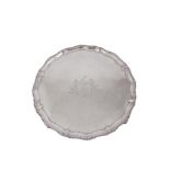 A GEORGE III SHAPED CIRCULAR SALVER, London 1767, mark of Richard Rugg I, with gadrooned border, the