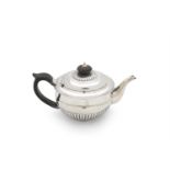 A LATE GEORGE III SILVER TEAPOT, London 1805, mark of Richard Cooke, of circular form, with