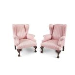 A PAIR OF 19TH CENTURY MAHOGANY AND UPHOLSTERED WING-BACK ARMCHAIRS, each covered in a striped