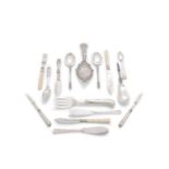 A SUNDRY COLLECTION OF ORNAMENTAL SILVER CUTLERY, SERVING PIECES, BUTTER KNIVES ETC.