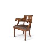 A BIEDERMEIER STYLE PALE MAHOGANY OPEN ARMCHAIR, with tub back, the seat upholstered in tan coloured