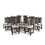 A SET OF TWELVE JACOBEAN STYLE STAINED OAK DINING CHAIRS, including two elbow chairs, with shaped