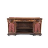 A VICTORIAN MAHOGANY SIDEBOARD, with twin bow cupboards at either end, the doors lined with red silk