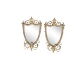 A PAIR OF LATE GEORGE III GILTWOOD FRAMED GIRANDOLE WALL MIRRORS, in the neo-classical taste, of